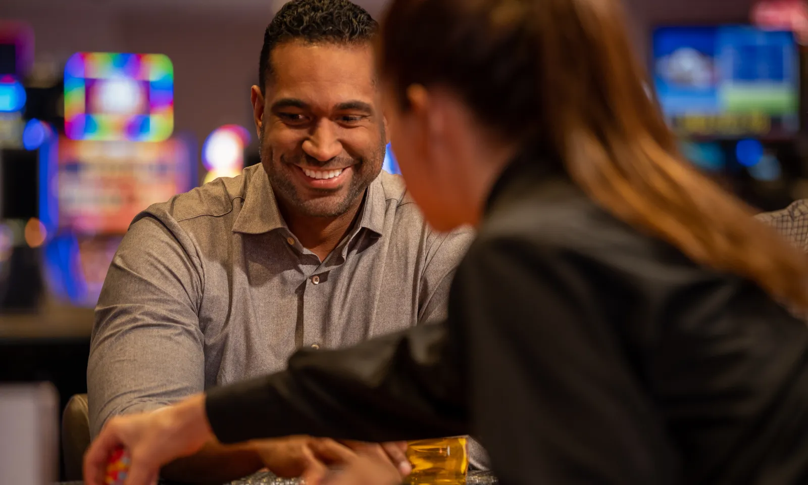 Man smiling while playing blackjack